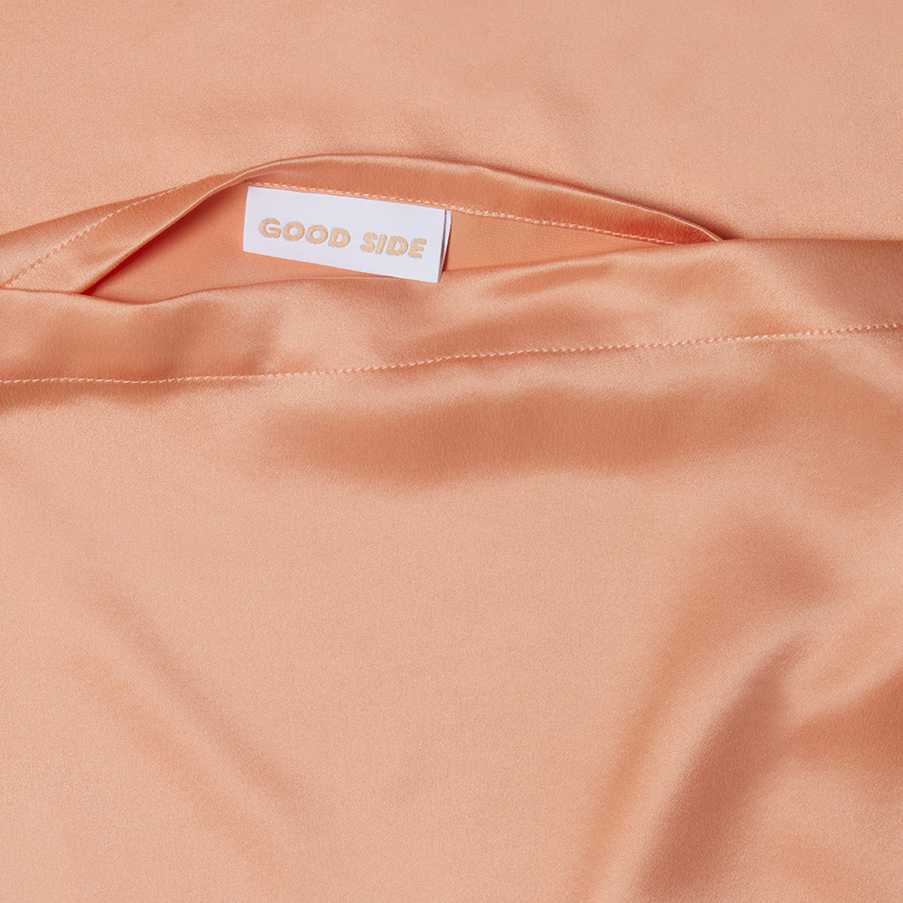 silk pillowcase in peach close up