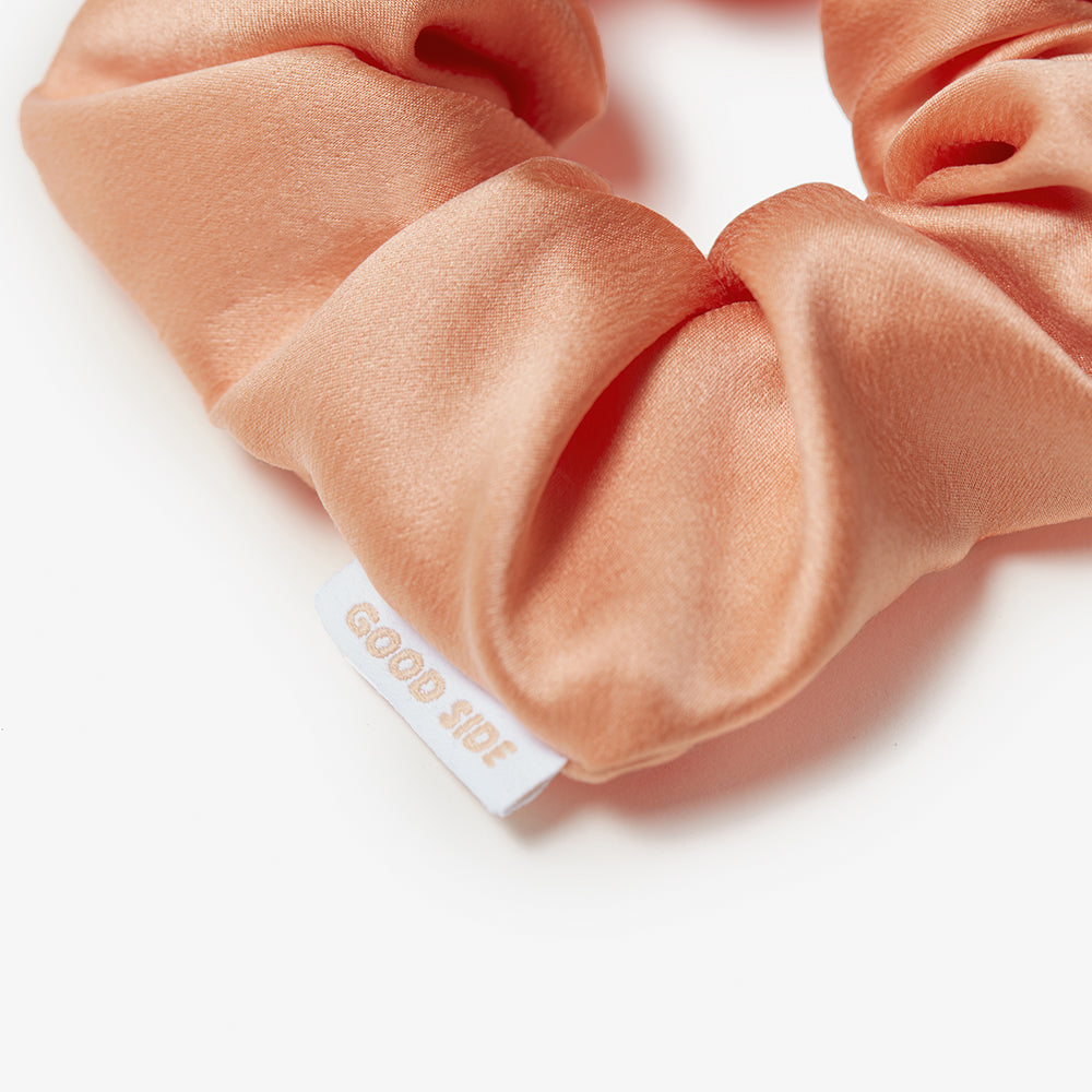 classic silk scrunchie in peach close up